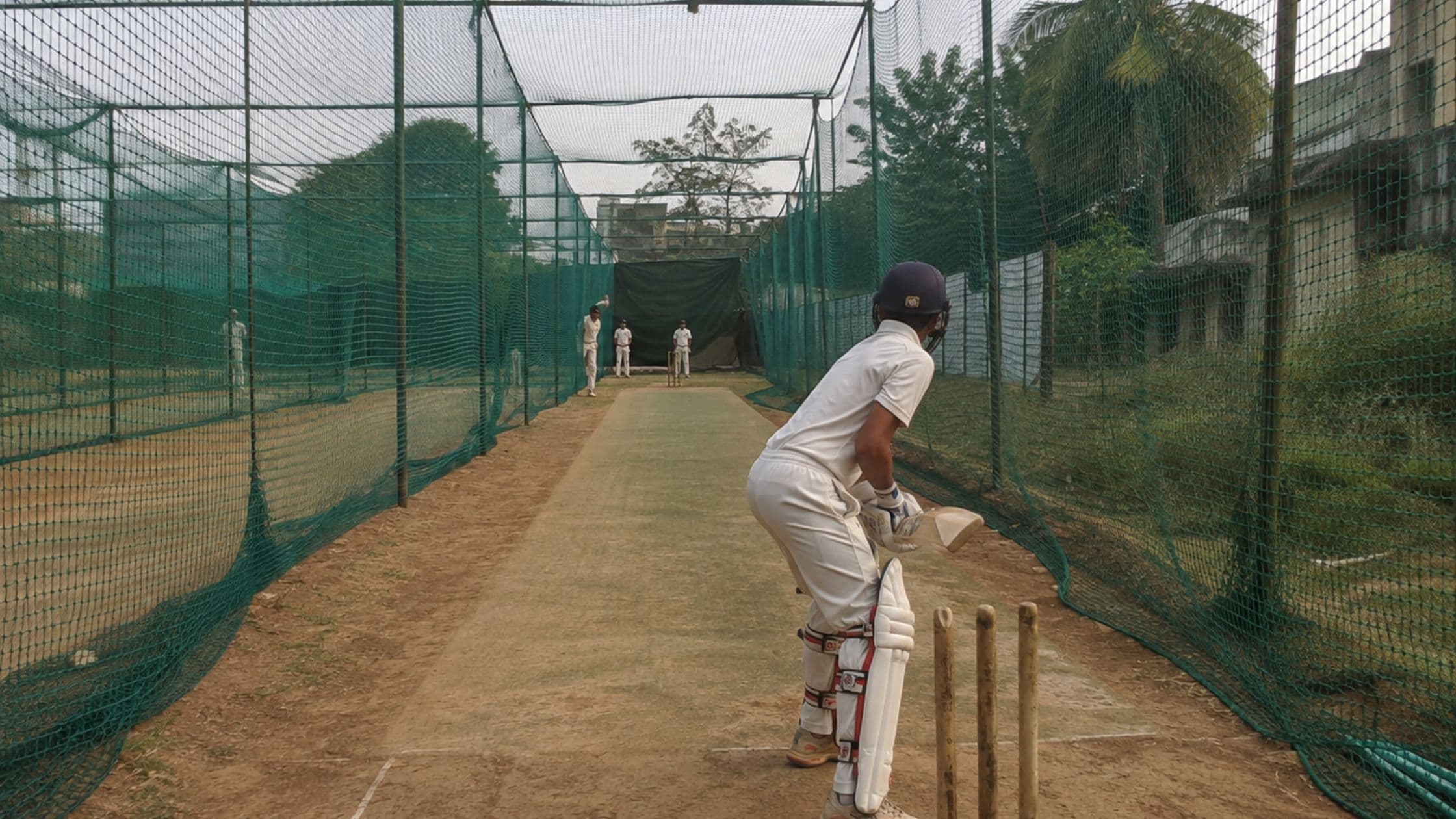 Cricket practice area enclosed with sports safety nets